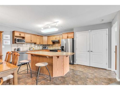 1315-303 Arbour Crest Drive Nw, Calgary, AB - Indoor Photo Showing Kitchen With Stainless Steel Kitchen