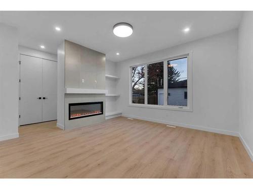 7108 36 Avenue Nw, Calgary, AB - Indoor Photo Showing Living Room With Fireplace