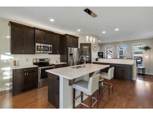 733 River Heights Crescent, Cochrane, AB - Indoor Photo Showing Kitchen With Stainless Steel Kitchen With Double Sink With Upgraded Kitchen