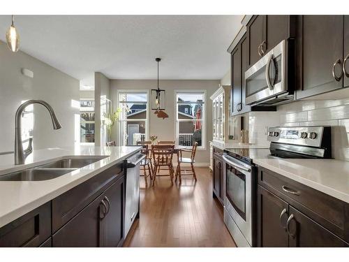 733 River Heights Crescent, Cochrane, AB - Indoor Photo Showing Kitchen With Stainless Steel Kitchen With Double Sink With Upgraded Kitchen