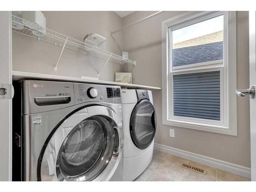 733 River Heights Crescent, Cochrane, AB - Indoor Photo Showing Laundry Room