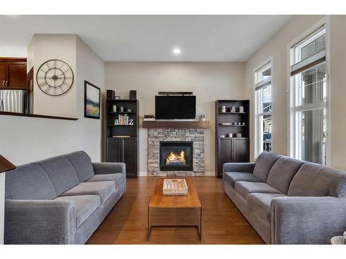 733 River Heights Crescent, Cochrane, AB - Indoor Photo Showing Living Room With Fireplace