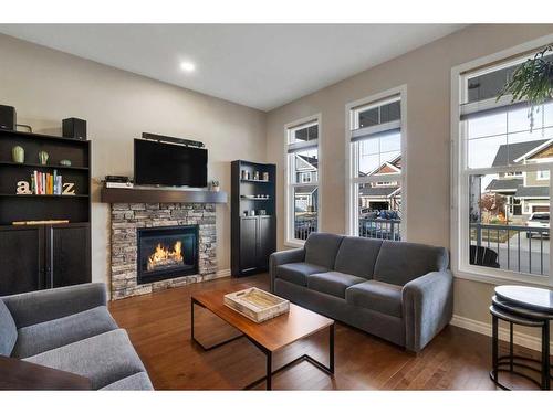 733 River Heights Crescent, Cochrane, AB - Indoor Photo Showing Living Room With Fireplace