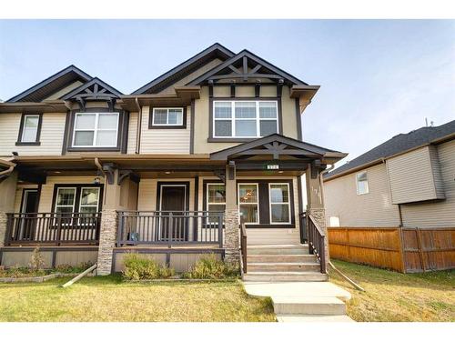 174 Clydesdale Way, Cochrane, AB - Outdoor With Deck Patio Veranda With Facade