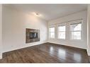 174 Clydesdale Way, Cochrane, AB  - Indoor Photo Showing Other Room With Fireplace 