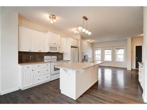 174 Clydesdale Way, Cochrane, AB - Indoor Photo Showing Kitchen With Double Sink