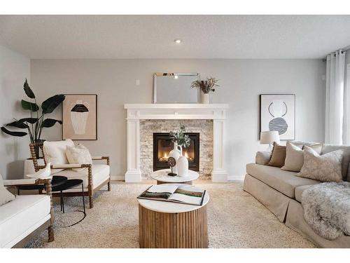 17 Riviera Place, Cochrane, AB - Indoor Photo Showing Living Room With Fireplace