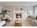 17 Riviera Place, Cochrane, AB  - Indoor Photo Showing Living Room With Fireplace 