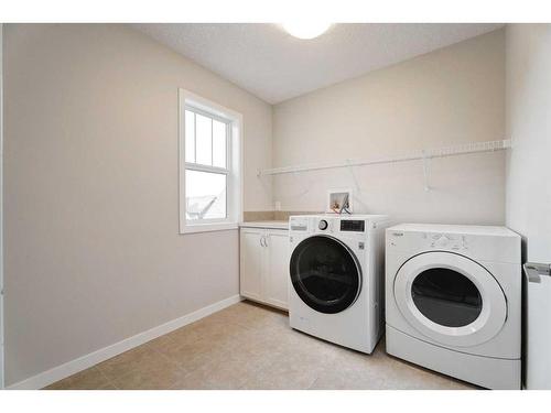 17 Riviera Place, Cochrane, AB - Indoor Photo Showing Laundry Room