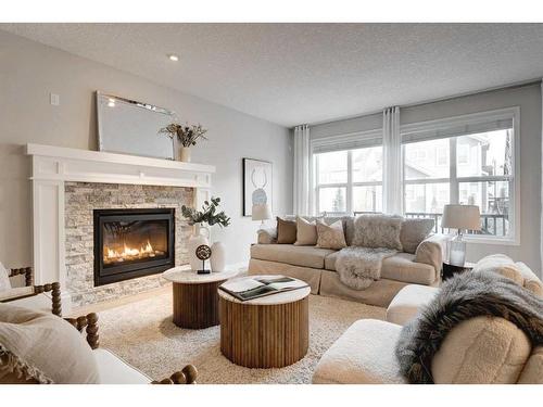 17 Riviera Place, Cochrane, AB - Indoor Photo Showing Living Room With Fireplace