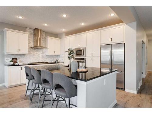 17 Riviera Place, Cochrane, AB - Indoor Photo Showing Kitchen With Stainless Steel Kitchen With Upgraded Kitchen