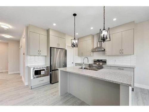 486 Clydesdale Way, Cochrane, AB - Indoor Photo Showing Kitchen With Stainless Steel Kitchen With Upgraded Kitchen