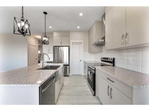 486 Clydesdale Way, Cochrane, AB - Indoor Photo Showing Kitchen With Stainless Steel Kitchen With Upgraded Kitchen