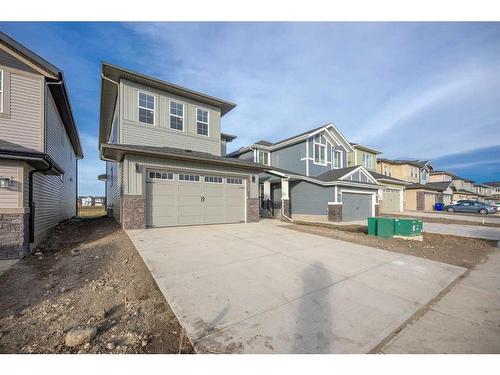 486 Clydesdale Way, Cochrane, AB - Outdoor With Facade