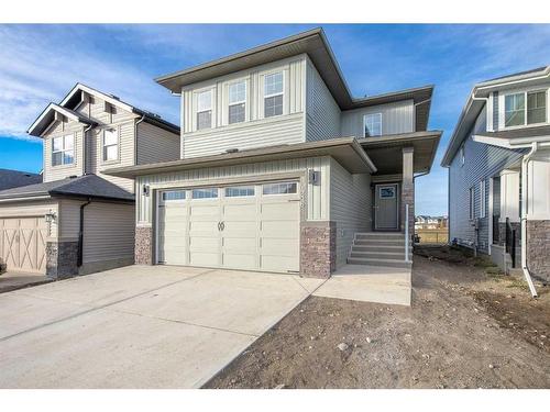 486 Clydesdale Way, Cochrane, AB - Outdoor With Facade