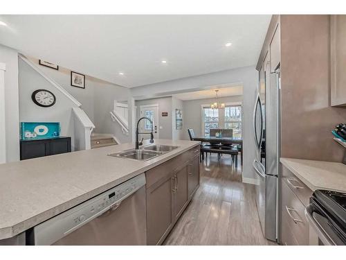 73 Fireside Bend, Cochrane, AB - Indoor Photo Showing Kitchen With Stainless Steel Kitchen With Double Sink