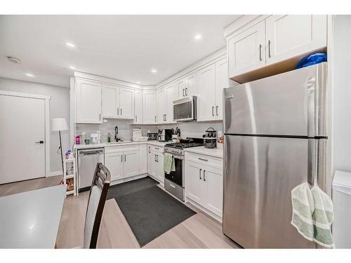 73 Fireside Bend, Cochrane, AB - Indoor Photo Showing Kitchen With Stainless Steel Kitchen