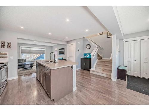 73 Fireside Bend, Cochrane, AB - Indoor Photo Showing Kitchen With Double Sink