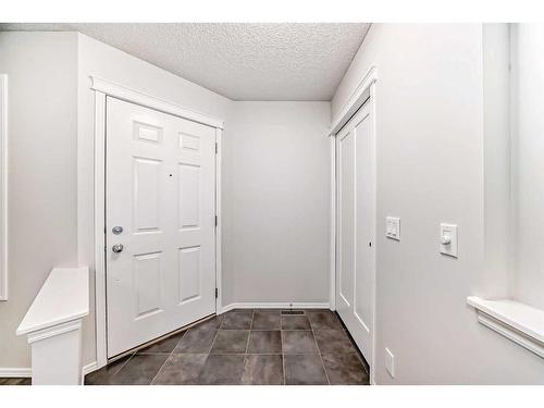 135 Cougarstone Square Sw, Calgary, AB - Indoor Photo Showing Other Room