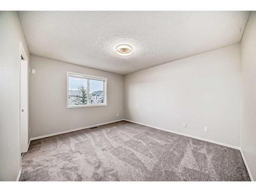 135 Cougarstone Square Sw, Calgary, AB - Indoor Photo Showing Other Room