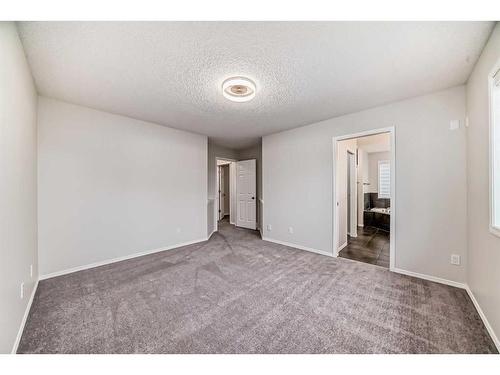 135 Cougarstone Square Sw, Calgary, AB - Indoor Photo Showing Other Room