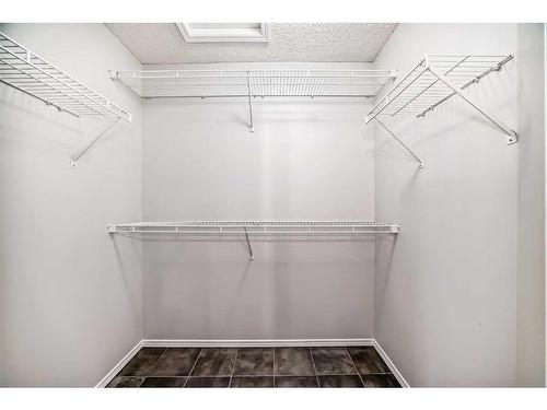 135 Cougarstone Square Sw, Calgary, AB - Indoor With Storage