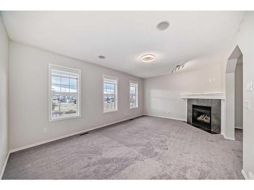 135 Cougarstone Square Sw, Calgary, AB - Indoor With Fireplace