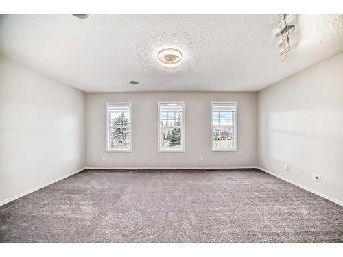 135 Cougarstone Square Sw, Calgary, AB - Indoor Photo Showing Other Room