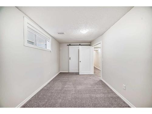 135 Cougarstone Square Sw, Calgary, AB - Indoor Photo Showing Other Room