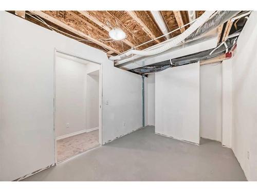 135 Cougarstone Square Sw, Calgary, AB - Indoor Photo Showing Basement