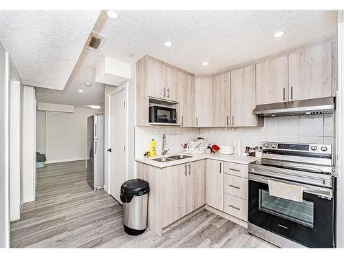 90 Corner Ridge Mews Ne, Calgary, AB - Indoor Photo Showing Kitchen With Double Sink