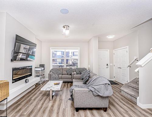 90 Corner Ridge Mews Ne, Calgary, AB - Indoor Photo Showing Living Room With Fireplace