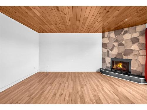 C-1407 44 Street Se, Calgary, AB - Indoor With Fireplace