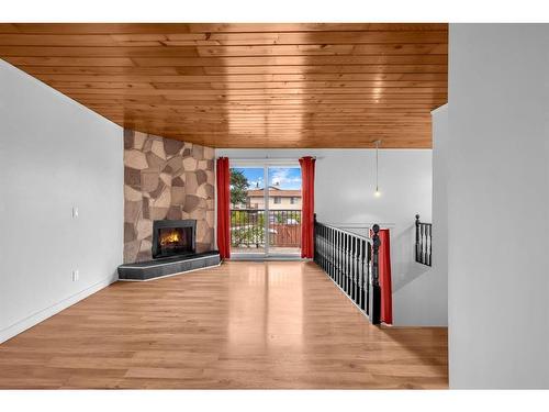 C-1407 44 Street Se, Calgary, AB - Indoor With Fireplace