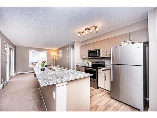 2420-4641 128 Avenue Ne, Calgary, AB - Indoor Photo Showing Kitchen With Stainless Steel Kitchen