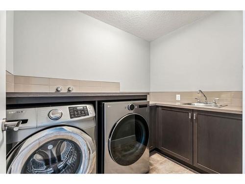 303 Tusslewood Terrace Nw, Calgary, AB - Indoor Photo Showing Laundry Room