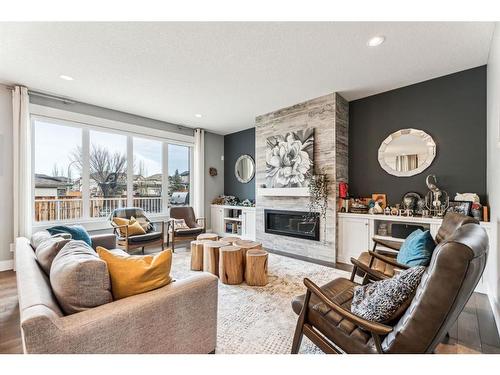 303 Tusslewood Terrace Nw, Calgary, AB - Indoor Photo Showing Living Room With Fireplace