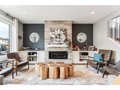 303 Tusslewood Terrace Nw, Calgary, AB - Indoor Photo Showing Living Room With Fireplace