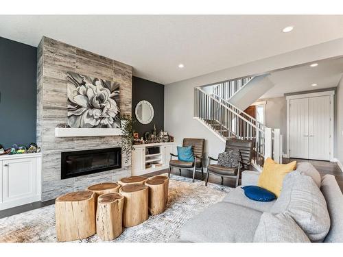 303 Tusslewood Terrace Nw, Calgary, AB - Indoor Photo Showing Living Room With Fireplace