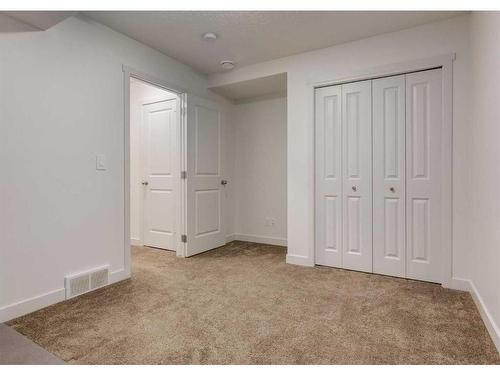 92 Carringvue Way Nw, Calgary, AB - Indoor Photo Showing Other Room