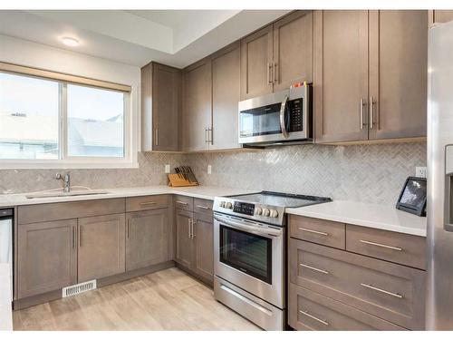 92 Carringvue Way Nw, Calgary, AB - Indoor Photo Showing Kitchen With Upgraded Kitchen