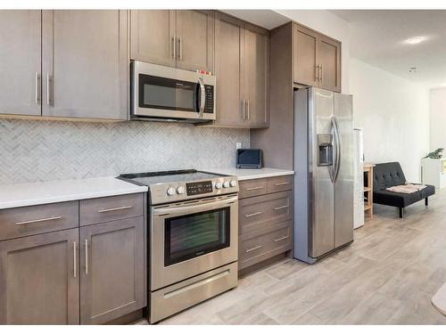 92 Carringvue Way Nw, Calgary, AB - Indoor Photo Showing Kitchen With Stainless Steel Kitchen