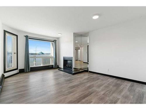 305-3727 42 Street Nw, Calgary, AB - Indoor Photo Showing Living Room With Fireplace