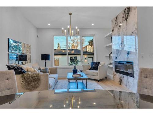 908 39 Street Sw, Calgary, AB - Indoor Photo Showing Living Room With Fireplace