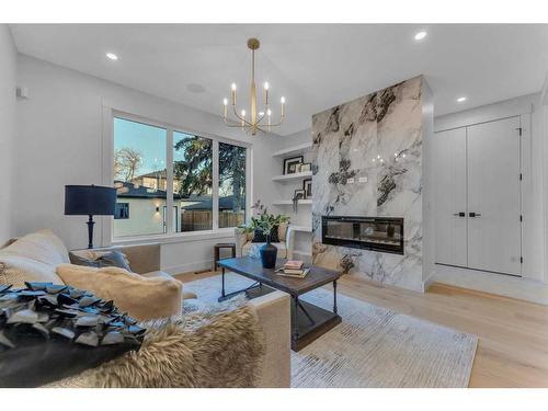 908 39 Street Sw, Calgary, AB - Indoor Photo Showing Living Room With Fireplace