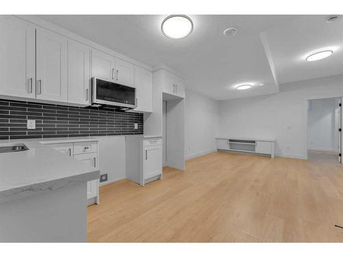 908 39 Street Sw, Calgary, AB - Indoor Photo Showing Kitchen With Double Sink