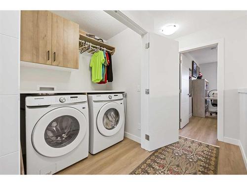 970 Harmony Parade, Rural Rocky View County, AB - Indoor Photo Showing Laundry Room