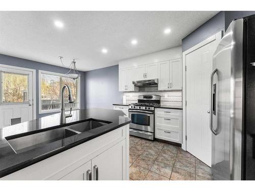 52 Shawbrooke Manor Sw, Calgary, AB - Indoor Photo Showing Kitchen With Double Sink With Upgraded Kitchen