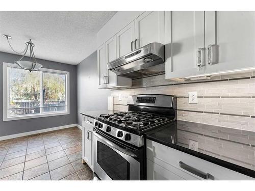 52 Shawbrooke Manor Sw, Calgary, AB - Indoor Photo Showing Kitchen With Upgraded Kitchen