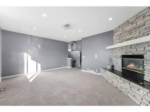 52 Shawbrooke Manor Sw, Calgary, AB - Indoor With Fireplace